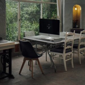 black flat screen computer monitor on brown wooden table